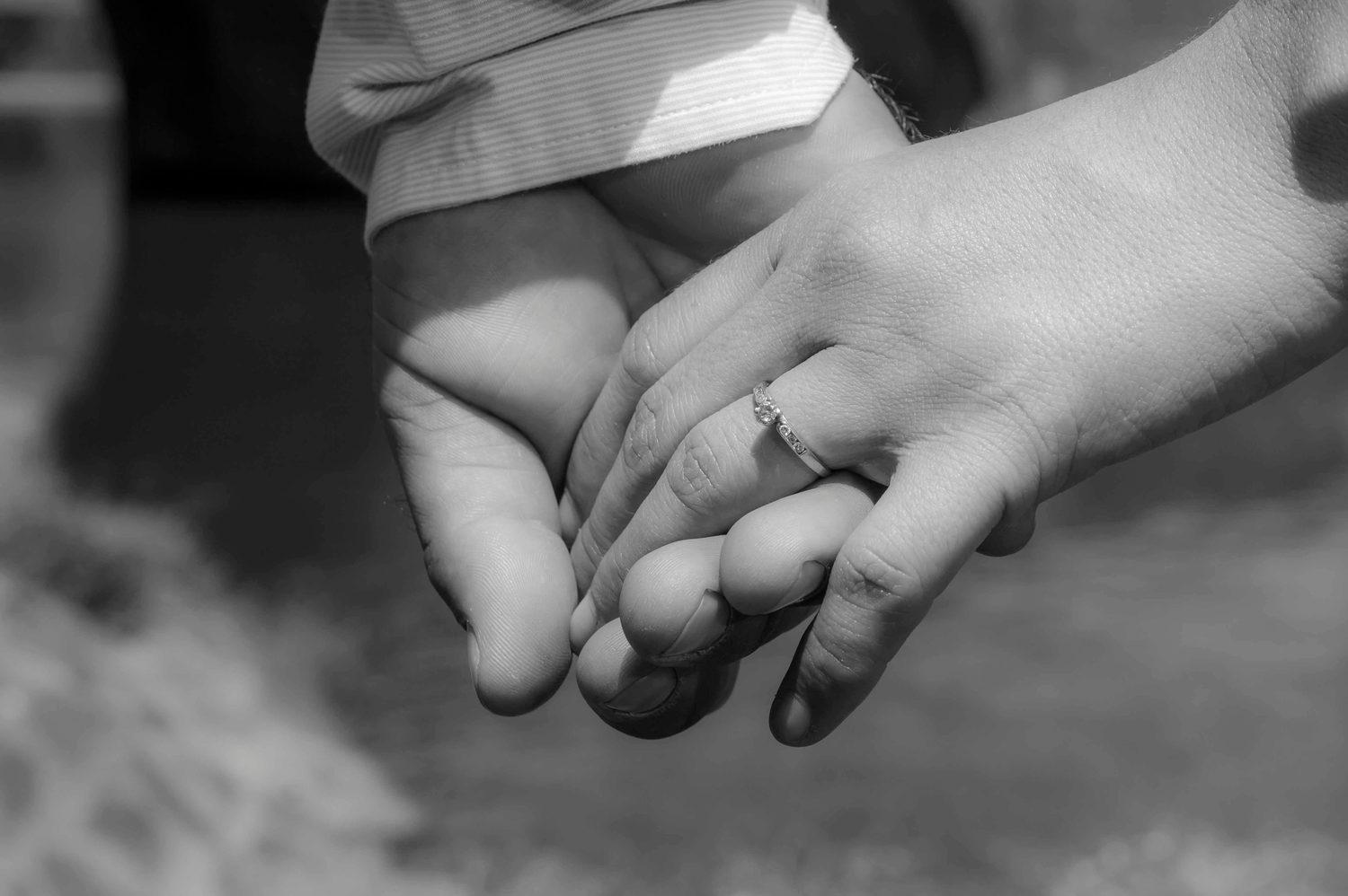 A couple's hands clasped together